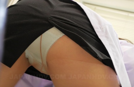 Clumsy Japanese nurse grabs her patient