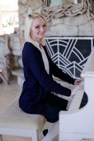 45264796_009_8376 Delicious blonde Sammie Daniels strips to her socks and plays piano