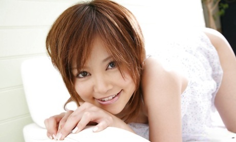 Tempting asian coed Hitomi Yoshino slipping off her lingerie