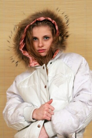 Skinny babe Lil Candy shows her tiny boobs while posing in her winter jacket