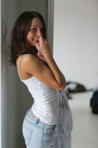 Sweet looking teen Foxy Di shows her natural tits and her lovely bum