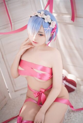 96184833_010_69d6-1 Beautiful Asian model with big tits poses while wrapped in pink satin ribbon