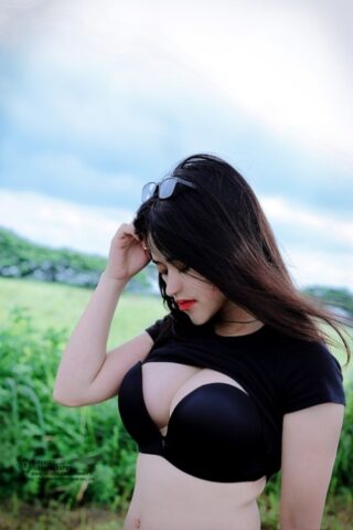 Sexy brunette babe Jessica Nguyễn flaunts her cleavage and flashes her tits