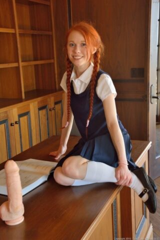 Ginger schoolgirl Dolly inserts a huge fake cock & Ben Wa balls into her pussy